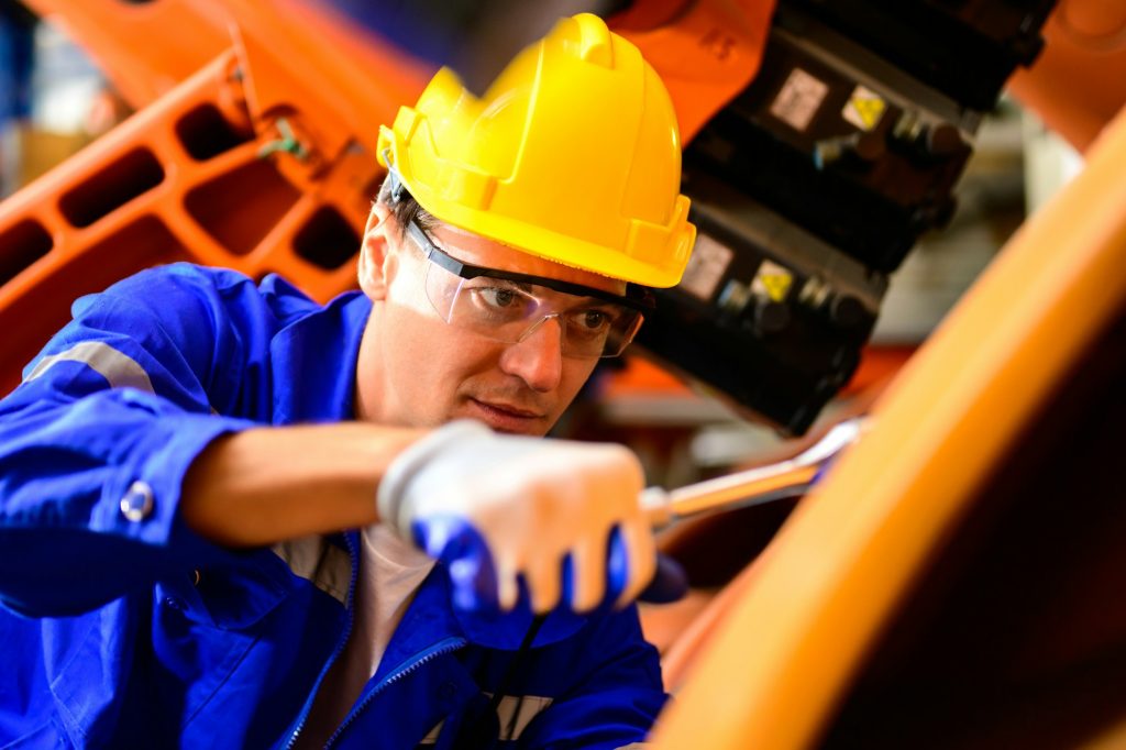 Portrait of expertise technician working at industrial plant